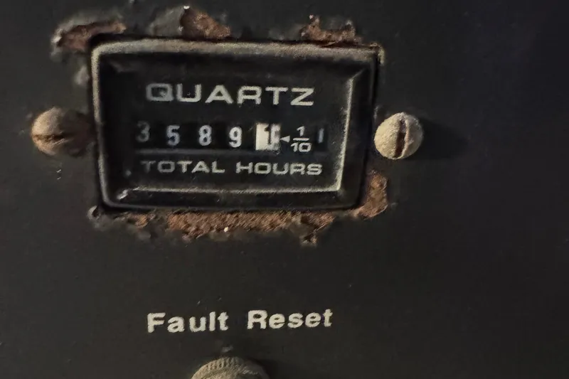 Slide: The Image of Hour meter reading 3589.1 hours on 1993 Viking 50 Convertible, with fault reset button. - 19