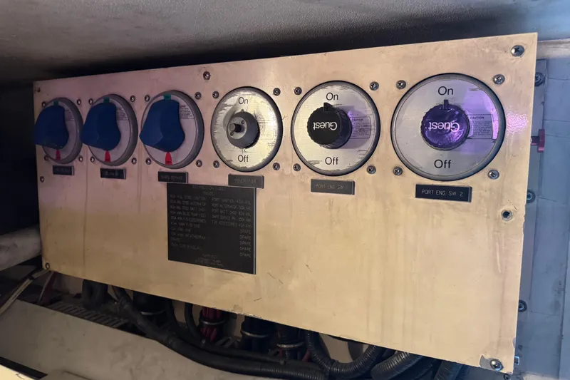 Slide: The Image of Electrical panel on a 1993 Viking 50 Convertible boat with labeled switches. - 21
