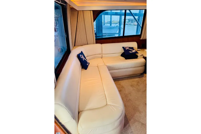 Slide: The Image of Luxurious interior of 1993 Viking 50 Convertible yacht with cream leather seating. - 22
