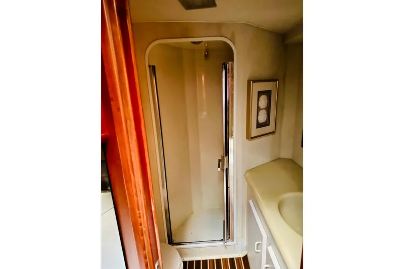 Slide: The Image of Bathroom interior of 1993 Viking 50 Convertible yacht with shower and sink. - 31