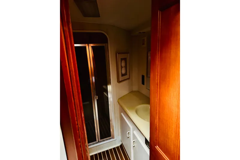 Slide: The Image of Bathroom interior of 1993 Viking 50 Convertible yacht with wooden accents and shower. - 35