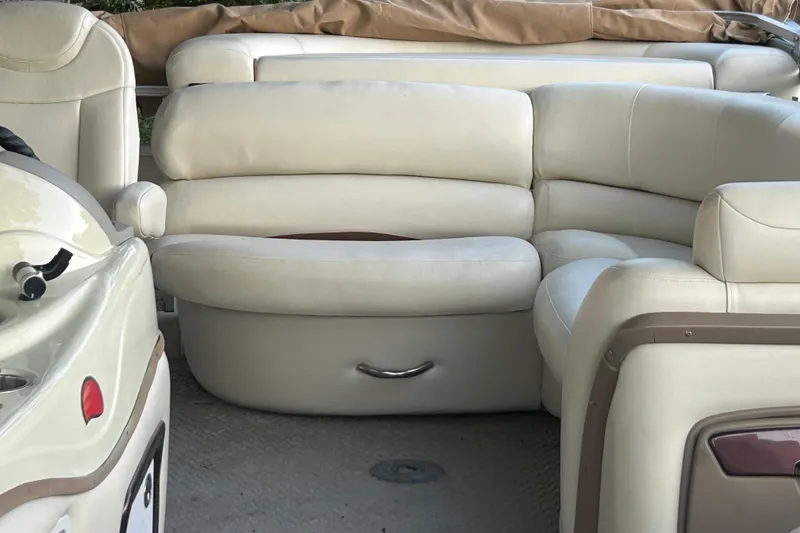 Slide: The Image of 2011 SUNTRACKER PARTY BARGE 22 REGENCY EDITION interior with beige seating and storage. - 12