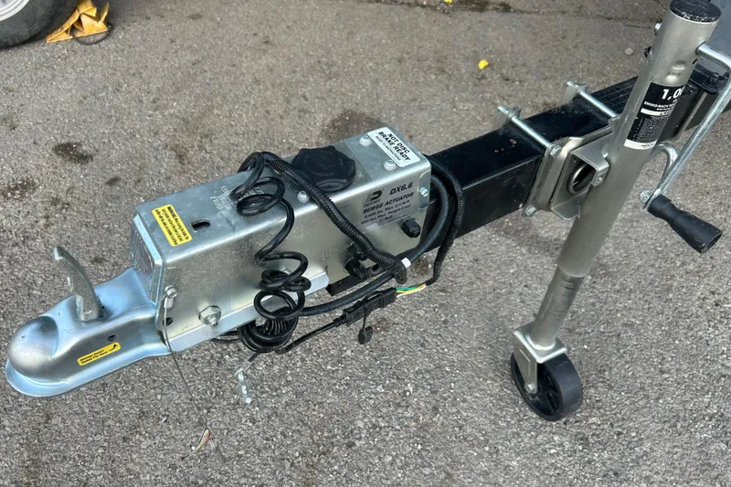 Slide: The Image of Trailer hitch and jack for 2011 SUNTRACKER PARTY BARGE 22 REGENCY EDITION on pavement. - 20