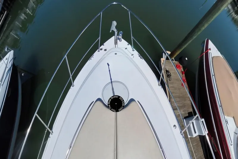 Slide: The Image of Bow view of 2005 Four Winns 348 Vista yacht docked at marina. - 10