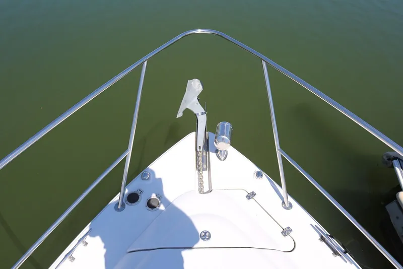 Slide: The Image of Bow of 2005 Four Winns 348 Vista boat with anchor, on calm water. - 11
