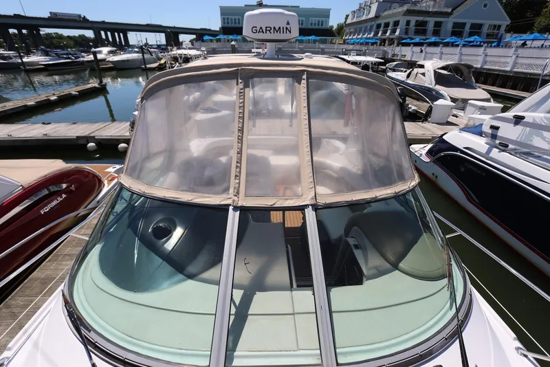 Slide: The Image of 2005 Four Winns 348 Vista boat docked at marina with Garmin equipment. - 14