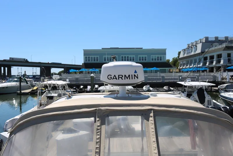 Slide: The Image of 2005 Four Winns 348 Vista boat with Garmin radar docked at marina. - 15