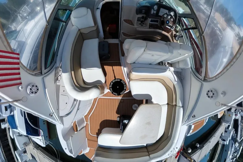 Slide: The Image of 2005 Four Winns 348 Vista yacht interior with seating and helm, docked at marina. - 18