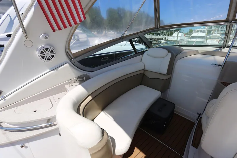 Slide: The Image of 2005 Four Winns 348 Vista boat interior with seating and American flag. - 22