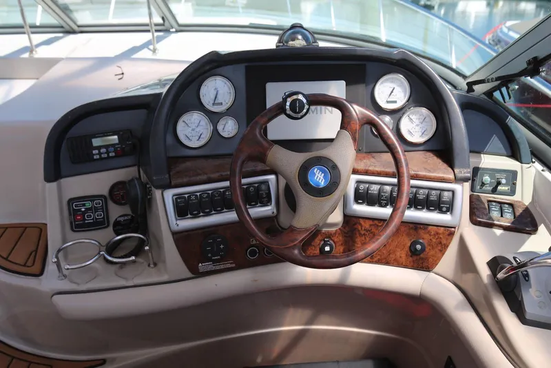 Slide: The Image of Cockpit of 2005 Four Winns 348 Vista boat with steering wheel and control panel. - 28