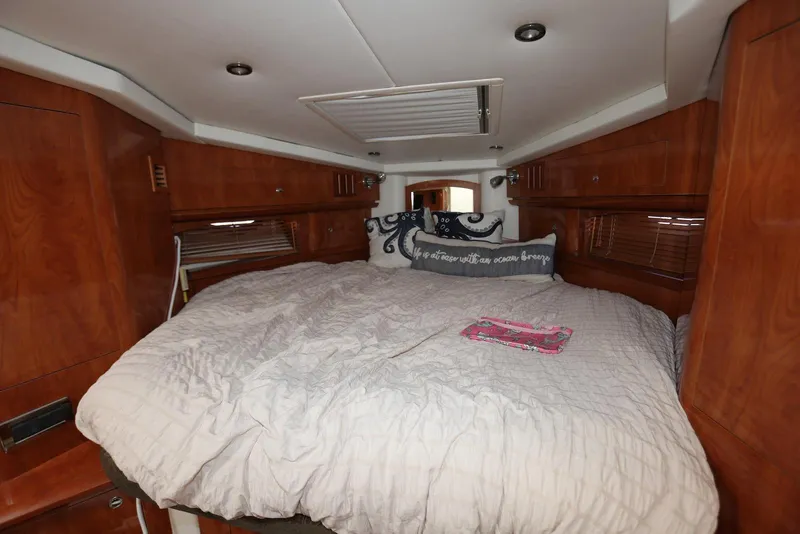 Slide: The Image of Luxurious cabin interior of 2005 Four Winns 348 Vista yacht with cozy bedding. - 41