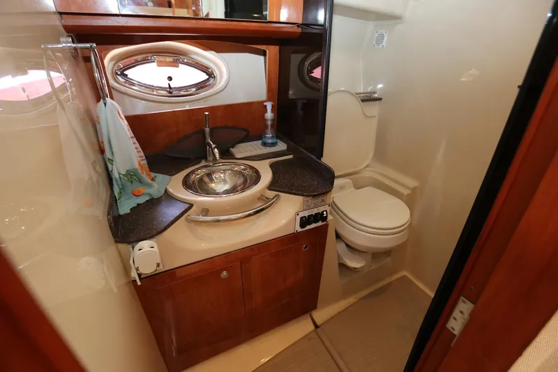Slide: The Image of Luxurious 2005 Four Winns 348 Vista yacht bathroom with sink and toilet. - 44