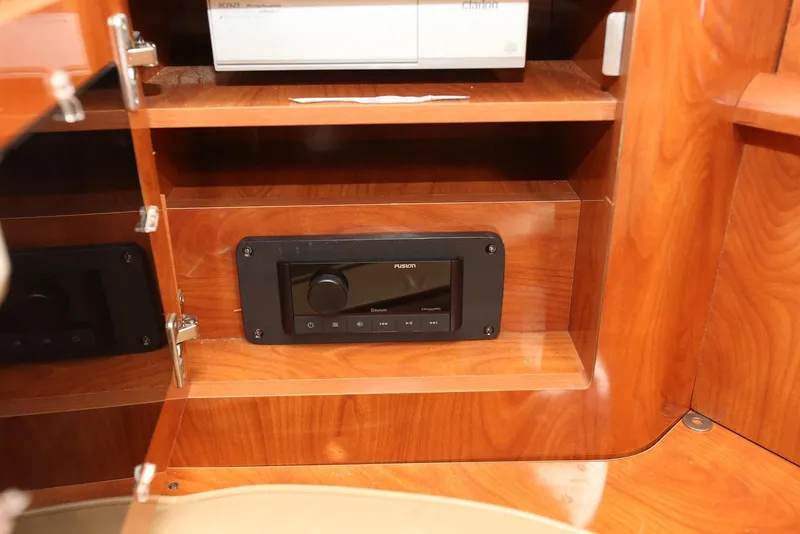 Slide: The Image of Interior of 2005 Four Winns 348 Vista with wooden cabinet and stereo system. - 47