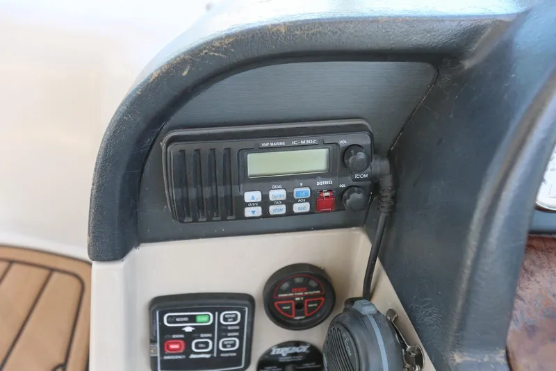 Slide: The Image of 2005 Four Winns 348 Vista boat dashboard with VHF marine radio and control panel. - 50