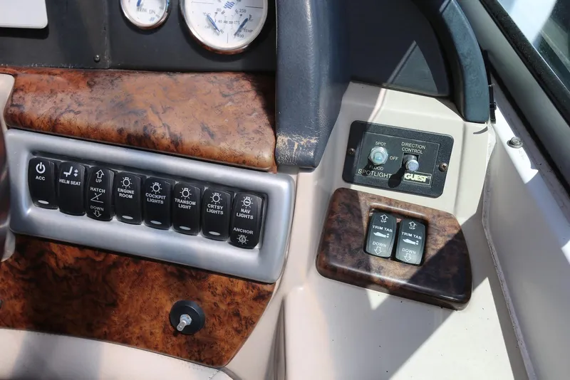 Slide: The Image of Control panel of 2005 Four Winns 348 Vista boat with various switches and gauges. - 52