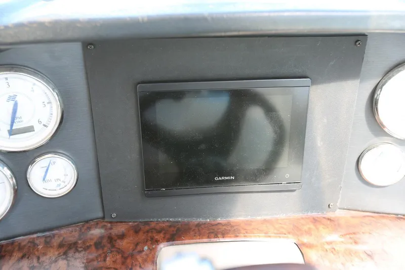 Slide: The Image of Dashboard of 2005 Four Winns 348 Vista with Garmin display and gauges. - 54