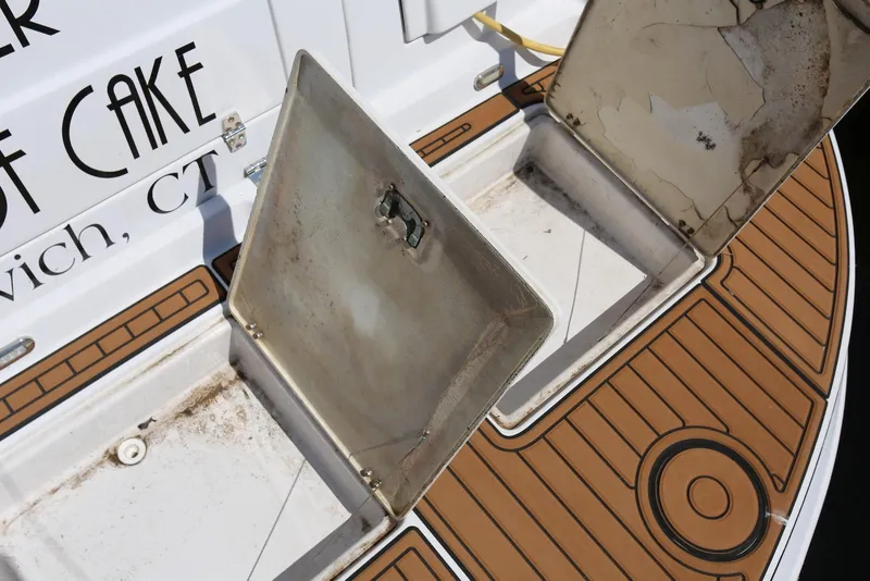 Slide: The Image of Open storage compartments on 2005 Four Winns 348 Vista boat deck. - 55