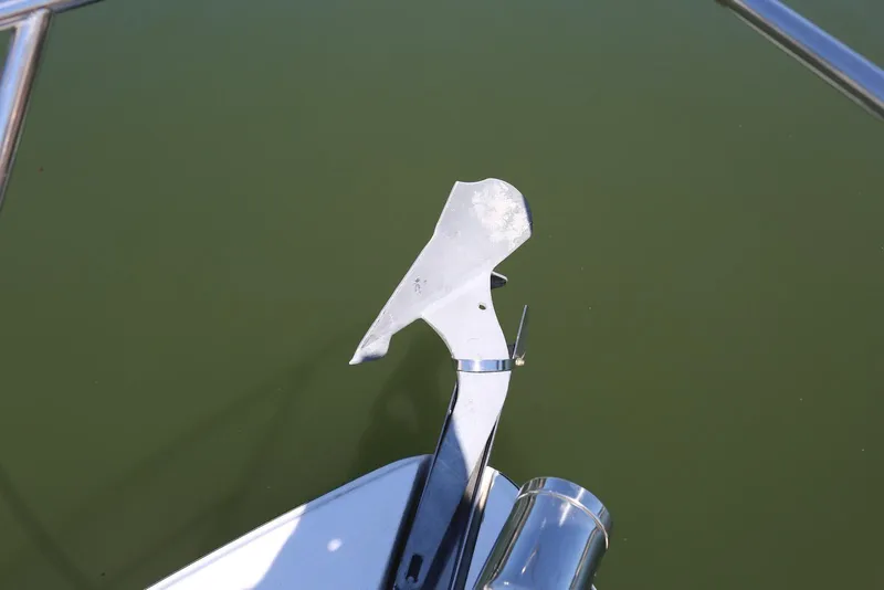 Slide: The Image of Anchor of 2005 Four Winns 348 Vista boat against green water background. - 58