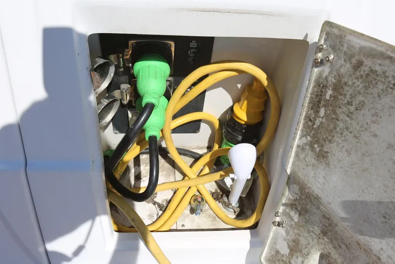 Slide: The Image of Electrical connections in a 2005 Four Winns 348 Vista boat compartment. - 61