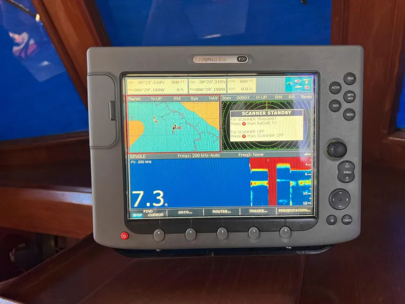 Slide: The Image of Navigation system on 1983 Lindmark 39 Trawler displaying marine charts and speed. - 36