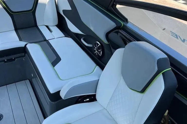 Slide: The Image of Interior of 2021 Yamaha Boats 255XD, featuring modern seating and sleek design elements. - 26