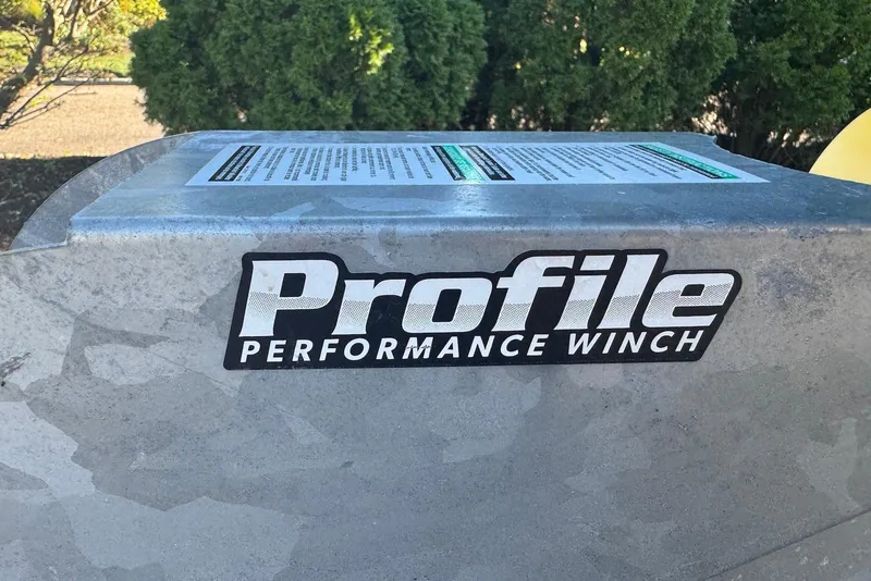 Slide: The Image of Profile Performance Winch on 2021 Yamaha Boats 255XD, outdoor setting with greenery. - 36