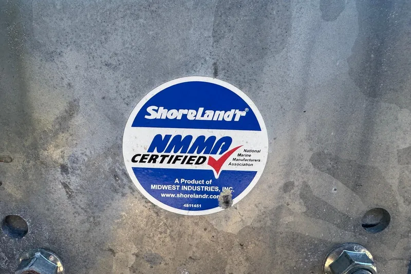 Slide: The Image of ShoreLand'r NMMA certified sticker on Yamaha Boats 255XD, 2021 model. - 37