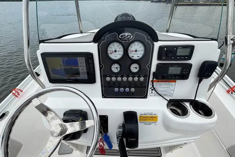 Slide: The Image of 2020 Sea Fox 186 Commander dashboard with steering wheel, gauges, and navigation equipment. - 10