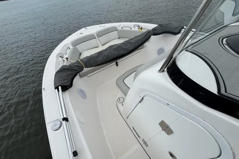 Slide: The Image of 2020 Sea Fox 186 Commander boat interior with seating and storage, on calm water. - 3