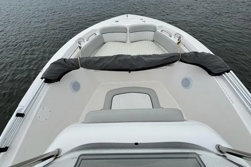 Slide: The Image of 2020 Sea Fox 186 Commander boat interior with cushioned seating on calm water. - 7