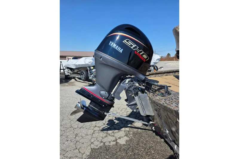 Slide: The Image of 2026 Xpress H18 Bass boat with Yamaha VMAX outboard motor, parked outdoors. - 11