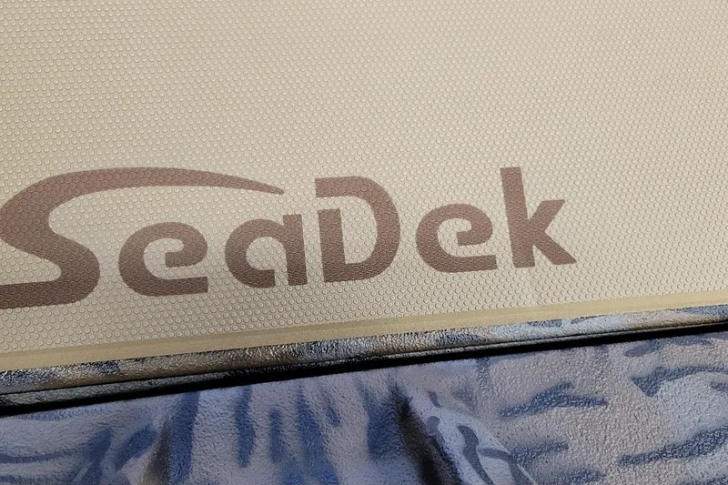 Slide: The Image of SeaDek logo on Xpress H18 Bass boat, 2026 model, featuring textured surface. - 3