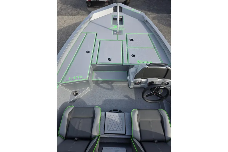 Slide: The Image of 2026 Xpress H18 Bass boat interior with gray and green accents, featuring seating and storage. - 12