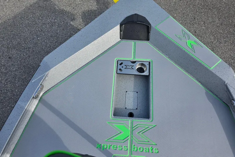 Slide: The Image of 2026 Xpress H18 Bass boat deck with green accents and logo. - 16