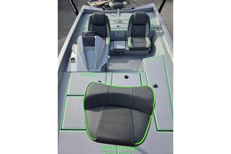 Slide: The Image of 2026 Xpress H18 Bass boat interior with gray and green seating and deck. - 17