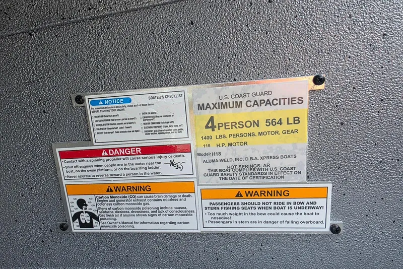 Slide: The Image of Warning labels on Xpress H18 Bass boat, 2026 model, detailing safety and capacity limits. - 22