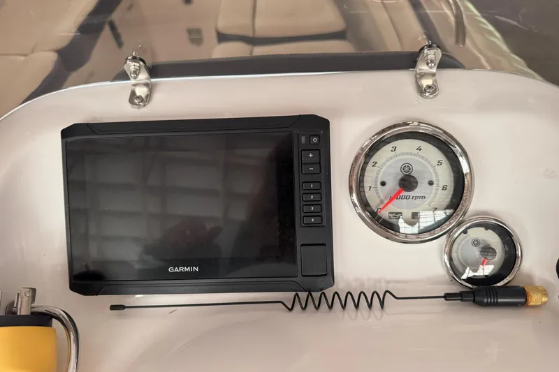Slide: The Image of 2024 Walker Bay Generation 525 dashboard with Garmin display and Yamaha gauges. - 20