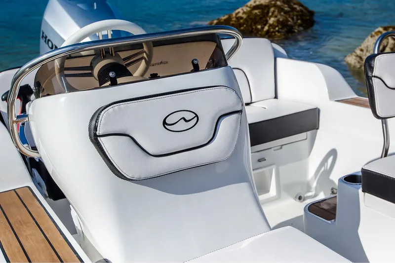 Slide: The Image of Manufacturer Provided Image: 2024 Walker Bay Generation 525 DLX boat interior with steering console and seating. - 6
