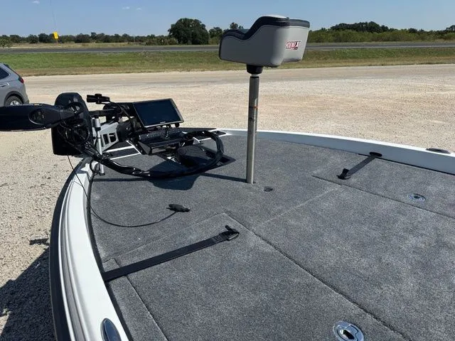 Slide: The Image of 2026 Phoenix 921 Elite X boat deck with fishing equipment and seat. - 3