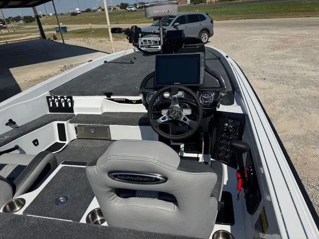 Slide: The Image of 2026 Phoenix 921 Elite X boat interior with steering wheel and dashboard controls. - 8