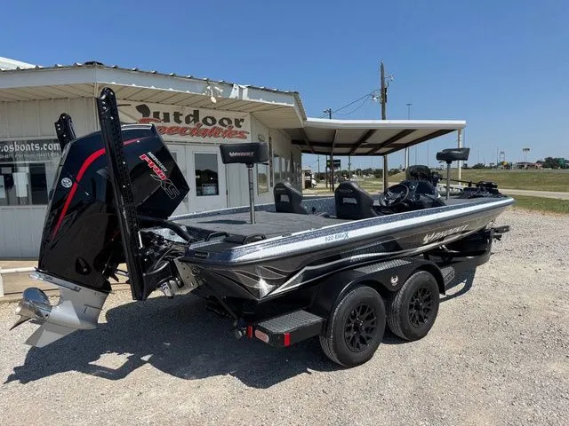 Slide: The Image of 2026 Phoenix 920 Elite X boat on trailer outside dealership. - 3