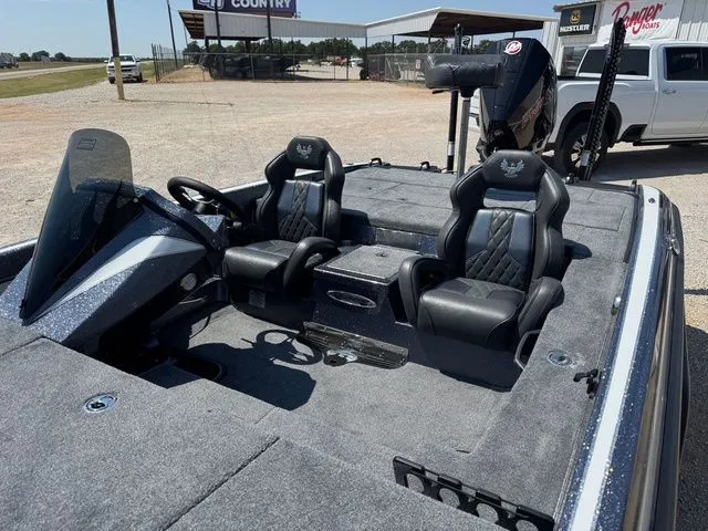 Slide: The Image of 2026 Phoenix 920 Elite X boat interior with dual seats and steering console. - 4