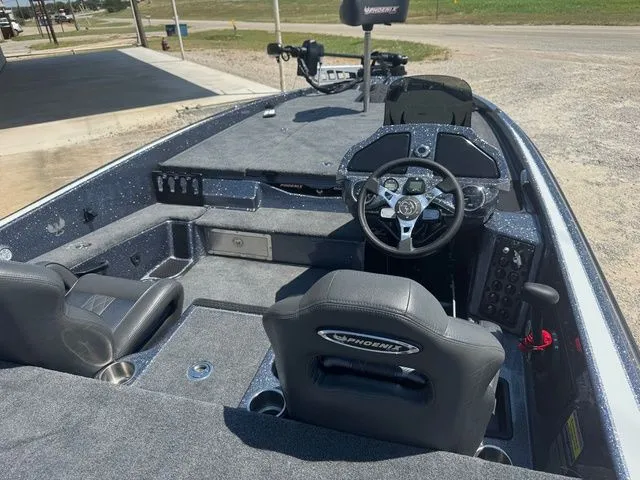 Slide: The Image of 2026 Phoenix 920 Elite X boat interior with steering wheel and seating. - 9