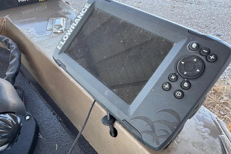 Slide: The Image of Fishfinder device on Xpress X51 boat, 2001 model, with control buttons and display screen. - 10