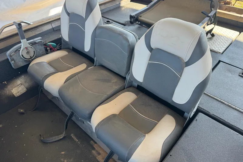Slide: The Image of Three gray and white boat seats in a 2001 Xpress X51 model interior. - 8