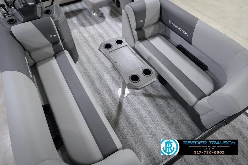 Slide: The Image of Interior of 2026 Bennington 22 SSB pontoon boat with gray seating and cup holders. - 13