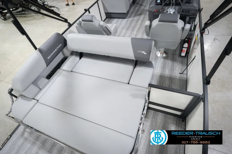 Slide: The Image of 2026 Bennington 22 SSB pontoon boat interior with gray seating and modern helm. - 14