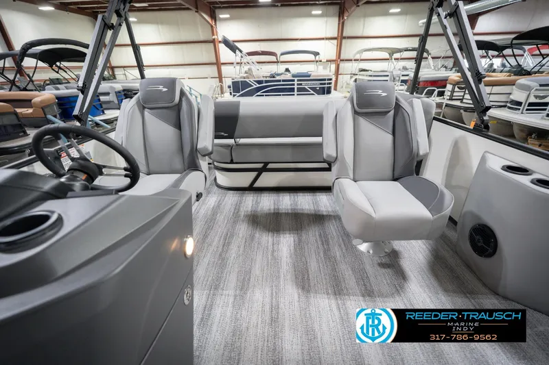 Slide: The Image of Interior of 2026 Bennington 22 SSB pontoon boat with modern seating and steering console. - 17