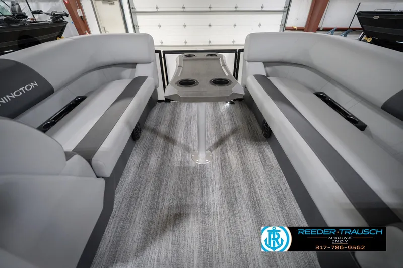 Slide: The Image of 2026 Bennington 22 SSB boat interior with gray seating and central table. - 21