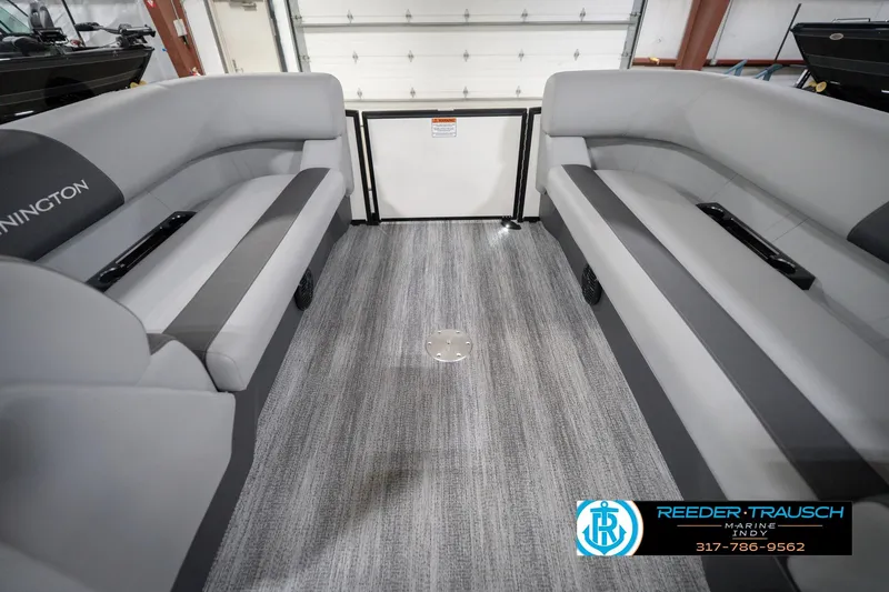 Slide: The Image of Interior of 2026 Bennington 22 SSB pontoon boat with gray seating and carpeted floor. - 22